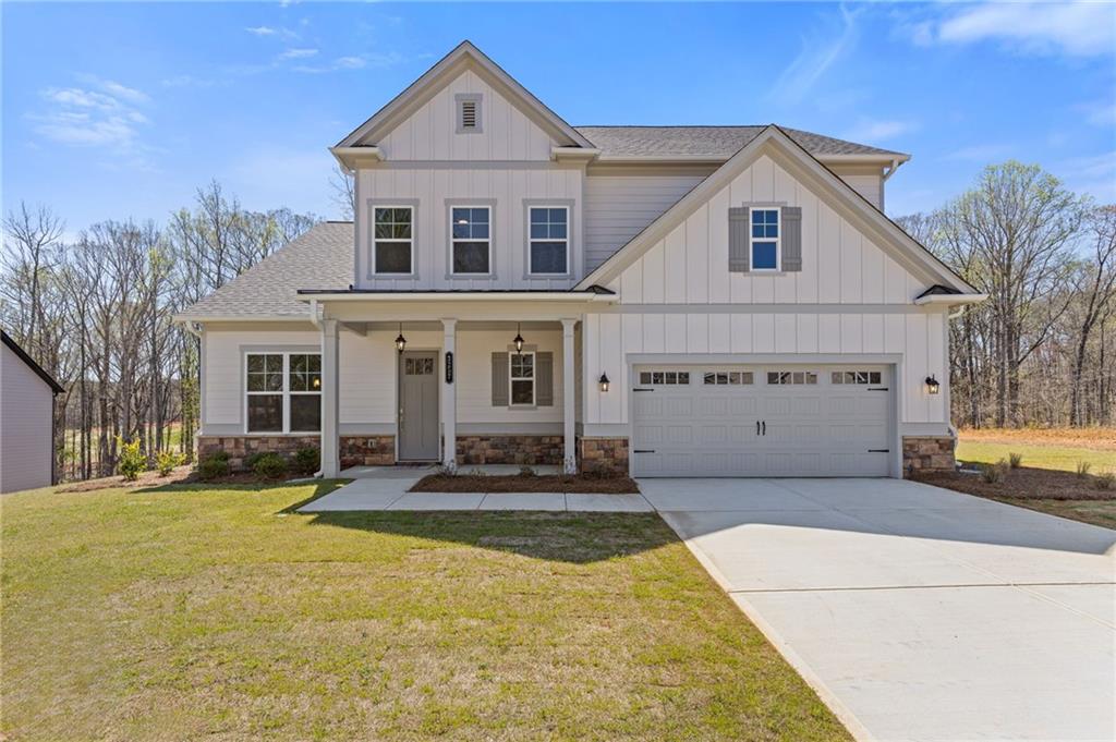 Escape the hustle and bustle in the newly opened phase at Traditions of Braselton! Discover the stunning Newport model by Paran Homes, designed for comfort and style. Relax as you take in serene, wooded backyard views from your spacious gourmet kitchen, featuring a walk-in pantry and an oversized island perfect for culinary adventures. The open-concept layout connects the kitchen to a cozy breakfast area and a warm, fireside family room—ideal for everyday living and entertaining.
This well-designed 5-bedroom floor plan includes a guest bedroom and full bath on the main level. Upstairs, you’ll find the luxurious primary suite, three additional generously sized bedrooms, a loft, and three more full bathrooms—including a junior suite!
Nestled in a premier community, you’ll enjoy exceptional amenities: play a round of golf, socialize at the clubhouse, stay active in the fitness center, or enjoy a game of tennis or pickleball. The Olympic-sized swimming pool with a giant water slide is perfect for cooling off and having fun.
Experience resort-style living at its best!
Visit our model home at 33 Backwater Lane, Jefferson, GA 30549.
Hours: Monday–Saturday 10 AM–6 PM | Sunday 12 PM–6 PM.