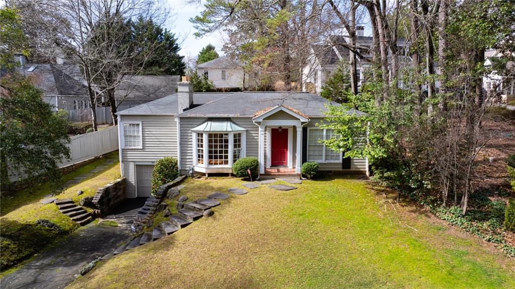 Unbeatable value in prime Garden Hills location. This charming home offers a fantastic amount of space and a fabulous location at an unbeatable price. Welcoming entrance foyer opens to a spacious family room featuring a fireplace and a large bay window that fills the room with natural sunlight and offers views of the front yard. A separate dining room. Gleaming hardwood floors throughout. The kitchen is equipped with granite countertops, stainless steel appliances, a gas range, and an undermount sink. Just off the kitchen, a bright family room with a wall of windows overlooks the backyard, offering plenty of natural light. The home includes three bedrooms. The two full bathrooms have granite-topped vanities. Beautiful hardwood floors run throughout the home. Additional features include a one-car attached garage. Home is being sold "AS IS". Whether you’re looking to update the existing structure or bring your builder, this is a must-see opportunity in a coveted neighborhood. Don’t miss this incredible opportunity to own in sought-after Garden Hills!