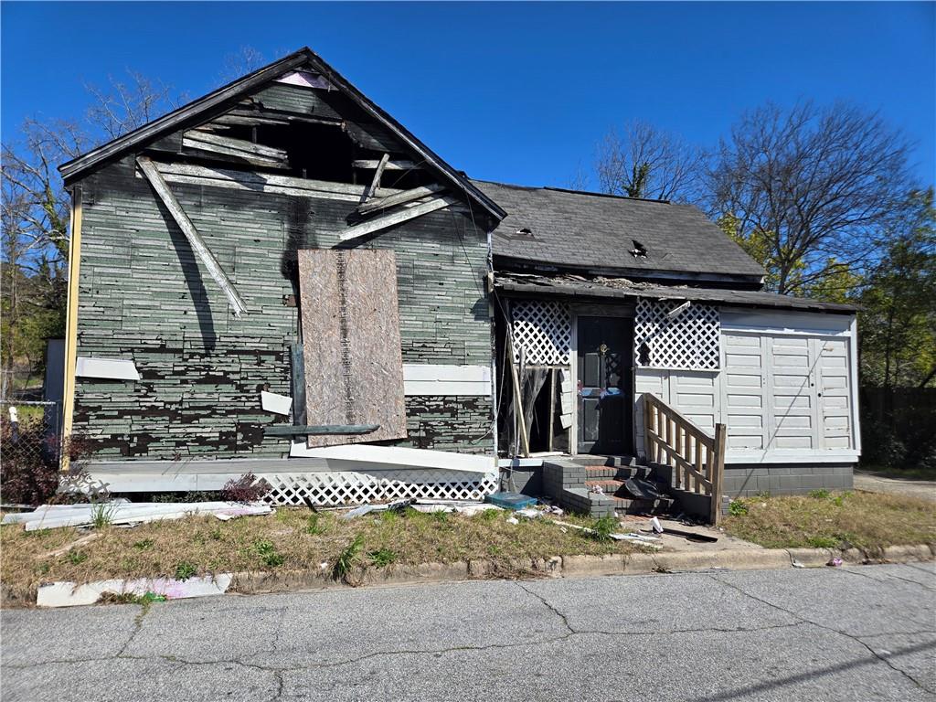 Attention Investors & Visionaries! This three-bedroom home, located in a C-1 zoned area of Macon, offers endless potential for redevelopment or restoration. The property has sustained significant fire damage and is being sold as-is with no disclosures. Whether you're looking for a complete tear-down or a unique rehab opportunity, this property is priced to move. This is Zoned C-1 Commercial with endless possibilities for mixed-use or business conversion. Please note, the property is unsafe due to fire damage. The seller and listing broker are not liable for any injuries sustained while on the premises. Buyers are strongly encouraged to perform their own due diligence prior to submitting an offer. Property will not qualify for traditional financing—cash or hard money only. This property is perfect for seasoned investors, builders, or commercial developers ready to bring this property back to life.