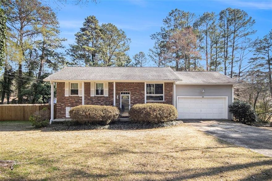 This inviting 3-bedroom, 2-bathroom split level home offers a comfortable and functional layout. The main level features a bright eat-in kitchen, a separate dining room, two generously sized bedrooms, and a full bathroom. On the lower level, you'll find the private primary bedroom complete with an ensuite bathroom, as well as a cozy family room and convenient laundry area. Enjoy the outdoors with a spacious patio, perfect for entertaining, and a newly installed wood fence providing privacy. Additional amenities include a two-car garage for your convenience. Don't miss out on this lovely home!