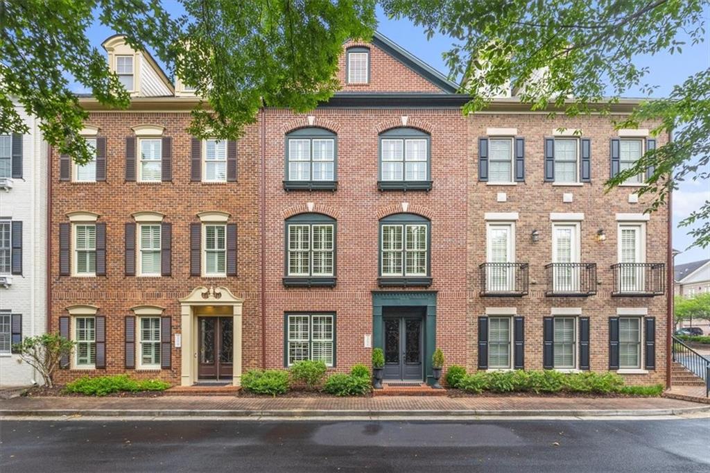 This beautiful townhome with elevator service to all 4 floors is located in the well-established sought-after One Ivy Walk, one of Smyrna/Vining’s most popular John Weiland communities. From the moment you walk into this unit, you will love the high ceiling in the entry foyer along with the beautiful double doors. On the 1st floor, you will find a living space (many owners have converted it into a bedroom) with built-in shelves and a full bathroom. The main level of this home offers an open floor plan, perfect for entertaining! The kitchen, with an oversized island, and plenty of cabinet space, has stainless steel appliances, granite countertops, and opens to one of the many sitting area/ family spaces. The dining room is perfectly located between the kitchen and another living space with a gas fireplace. On the third floor, you will find the oversized primary suite offering an additional living space with a coffered ceiling, and two walk-in custom closets. You are sure to enjoy relaxing in the whirlpool tub! There are double vanity and an oversized double shower. On the same floor, you will find a guest suite with a private bathroom with a tub/shower combo. There is a conveniently located laundry room with a sink and cabinets. On the 4th floor there is yet another oversized guest suite with a living space plus another full bath with tub/shower combo. Do not miss all the storage the 4th-floor offers. If shopping is your thing, there are numerous shops as well as a spa & nail salon just before the entry gates of One Ivy Walk. It is only a short walk to The West Village for more restaurants and shopping and less than a 5 min drive to Vinings Jubilee or The Battery-Trusit Park. Easy access to I-285 & I-75, only 15 minutes to Buckhead, Midtown, or D’town, and 20 min to ATL airport. The community offers a newly renovated gym (completion date June 2023) and a beautiful clubhouse overlooking one of the best community pools in Smyrna. If you have a dog, there is a dog park too! Do not miss out on this stunning unit and a rare opportunity to live in the prestige One Ivy Walk. Make your appointment today.