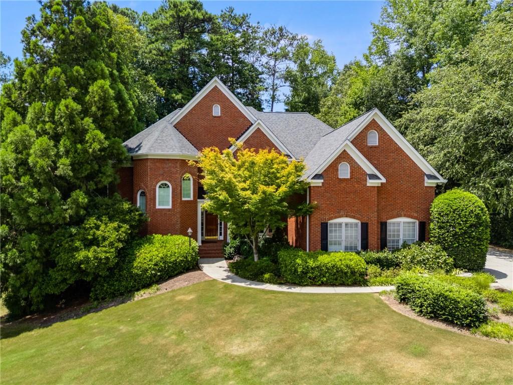 Tucked Away on a Serene Cul-de-Sac you’ll find this traditional brick beauty nestled in one of Dunwoody’s most sought-after neighborhoods. Welcome to the perfect blend of tradition, luxury and location. This stunner is situated on an oversized completely fenced quiet wooded lot complete with mature magnolias surrounding an inground heated gunite pool and spa. Through the grand foyer, you have an open floor plan with a massive dining room, a soaring living room with fireplace, as well as a private den off the living room. A sunroom is located off this den overlooking the beautiful pool and outdoor entertaining are complete with multi-level deck. Step back inside to discover an updated gourmet kitchen on this level, complete with high-end appliances, custom cabinetry, and sleek countertops—ideal for the home chef. Whether you're cooking for a crowd during the holidays or trying a new recipe for the family, this space is made for being together, connecting, laughing and making memories. A full bedroom and bath on the main floor provide a perfect space for guests, multigenerational living or a private office. Upstairs, you’ll find three generously sized secondary bedrooms (one with its own en-suite), plus a lavish primary suite featuring an updated spa-like bathroom you’ll never want to leave. The oversized primary closet includes a bonus room perfect for an additional home office, workout space, or additional storage. The fully finished basement is a home in and of itself, complete with separate entrance, a second kitchen, an additional bed and bath, as well as a spacious living area, and room for a home theater, teenage hang out or game room not to mention the unbelievable wealth of unfinished space for storage. (don't miss the sweet hidden room for hide and seek:).
Additional features include a spacious 3-car garage plus an extra parking pad — ideal for guests, hobby vehicles, or storage. Enjoy morning coffee or evening relaxation in the beautiful sunroom or step out onto the expansive deck overlooking your private, fenced backyard oasis. Cool off in the sparkling pool (recently having had an extensive facelift so that it’s brand new again), entertain under the stars, or simply unwind in the tranquility of your own retreat. All of this in a prime Dunwoody location, with top-rated schools, close proximity to premier shopping, fabulous dining, and an easy commute to anywhere in the city. This beautiful home combines timeless architecture with luxurious updates and thoughtful design, perfect for both everyday living and exceptional entertaining.