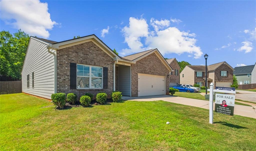 Welcome to the delightful Cannon floorplan in the sought-after Lovejoy Station neighborhood. This charming ranch-style home offers the ease of single-level living with a thoughtfully crafted split-bedroom layout. The master bedroom is a peaceful sanctuary, featuring sophisticated trey ceilings and a spacious walk-in closet. Three generously sized secondary bedrooms each include large closet spaces. The modern kitchen is equipped with sleek stainless steel appliances and stunning granite countertops, creating a stylish and practical space. The open-concept design facilitates effortless interaction between the living, dining, and kitchen areas, making it perfect for everyday living and entertaining. Step outside to your private, fenced yard. This home is an excellent choice for those seeking comfort, style, and convenience. Plus, it has an assumable mortgage of $237k with a 5.62% interest rate!