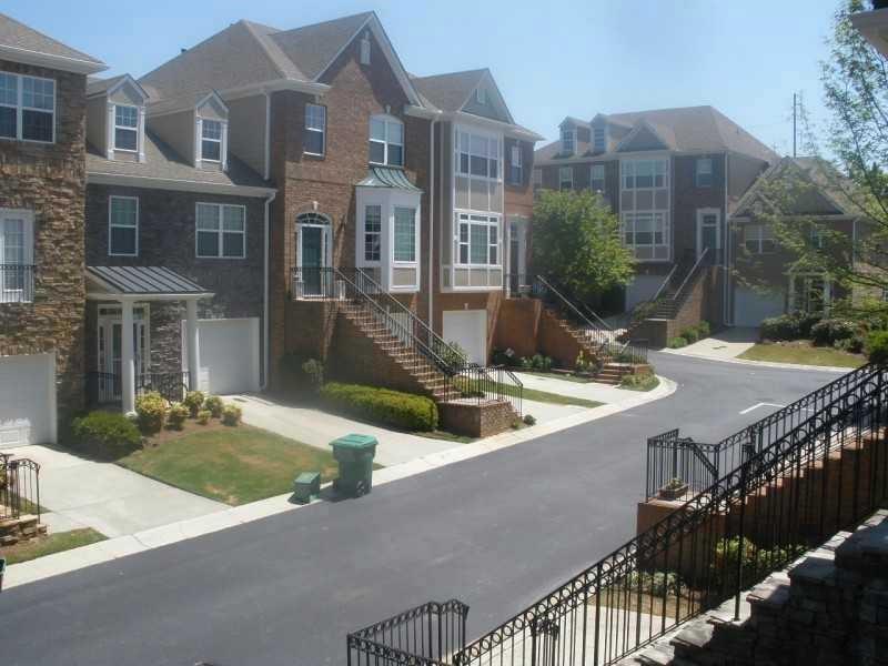 Fantastic location in the Northview School District! This gated community townhouse features hardwood floors on the main level and a kitchen with granite countertops. It's within walking distance to shops and restaurants, and backs up to a wooded area for added privacy. There are three bedrooms upstairs and a fourth on the terrace level, perfect for a bonus room, home office, or den.