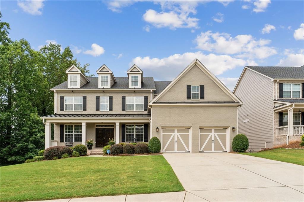 THIS IS IT! Welcome to this meticulously maintained craftsman-style home featuring unrivaled elegance, sophistication, and charm! Walk up to the stunning double front door and be welcomed by a double-story foyer with upgrades in every direction - wooden beams in the office, coffered ceilings in the living room, judges paneling in the formal dining room, and plantation shutters on the first AND second story windows! The kitchen is every chef's dream boasting a HUGE island, five burner gas range, stainless vent hood, double oven, and wine fridge. The two-story family room features three-tiered windows with beautiful sunset views - complete with a built-in sound system for entertaining. Full bath and guest bedroom on the main level. Upstairs, retreat to the oversized primary suite featuring a spa-like bathroom with double shower head, extra large soaking tub, double vanity, and MASSIVE walk-in closet! The laundry room is conveniently located with access to upstairs hallway AND primary bath! The full, unfinished basement offers an extra 1,700 sqft of opportunity - not included in the listing square footage! Outside, the freshly painted brick, trim, deck, and steps shine alongside custom outdoor lighting! Located beside a wooded, vacant lot, enjoy one of the newest homes in the Lakeside neighborhood - with LAKE access, fishing, kayaking, pool, pickleball, tennis, and playground! Desirable school district and ideal location - 4.4 miles to Downtown Woodstock, 10 miles to Roswell, 13 miles to Alpharetta, and 18 miles to The Battery. This Woodstock beauty is one of a kind!