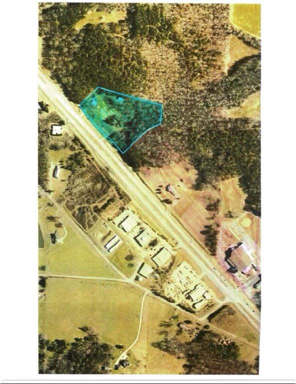 Commercial potential on 5.5 acres with 600 feet on Highway 27. 3000 sq ft office space, storage barn, 2 driveways, 2 electric meters, one water meter. Daily traffic count 12,000