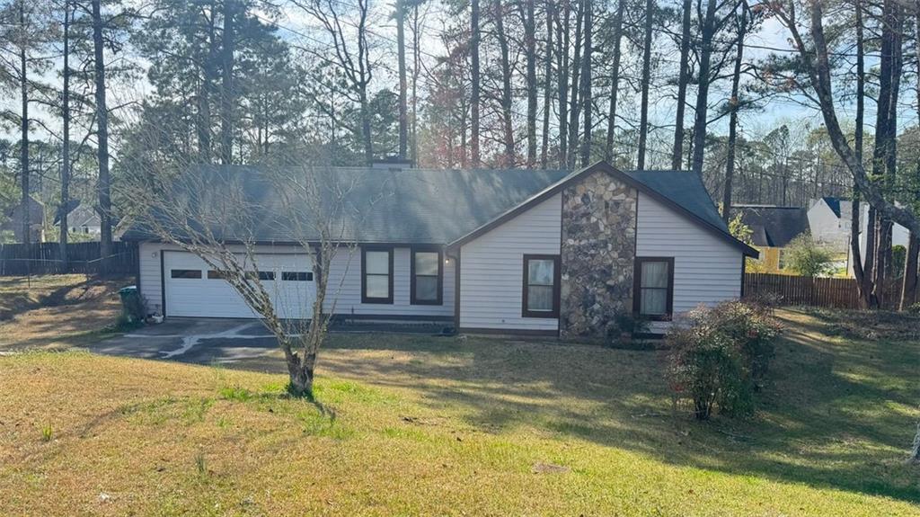 Welcome to this charming home in the heart of Lilburn! This 3-bedroom, 2-bath home offers a solid foundation and endless potential to make it your own. Featuring a spacious layout, a cozy living room with fireplace, and a large backyard perfect for entertaining, gardening, or just relaxing in your own private space. Located in a quiet, established neighborhood with no HOA, you’ll enjoy the freedom to without restrictions. Conveniently close to schools, parks, shopping, and major highways for easy commuting. This property won’t last long! Property sold as-is.