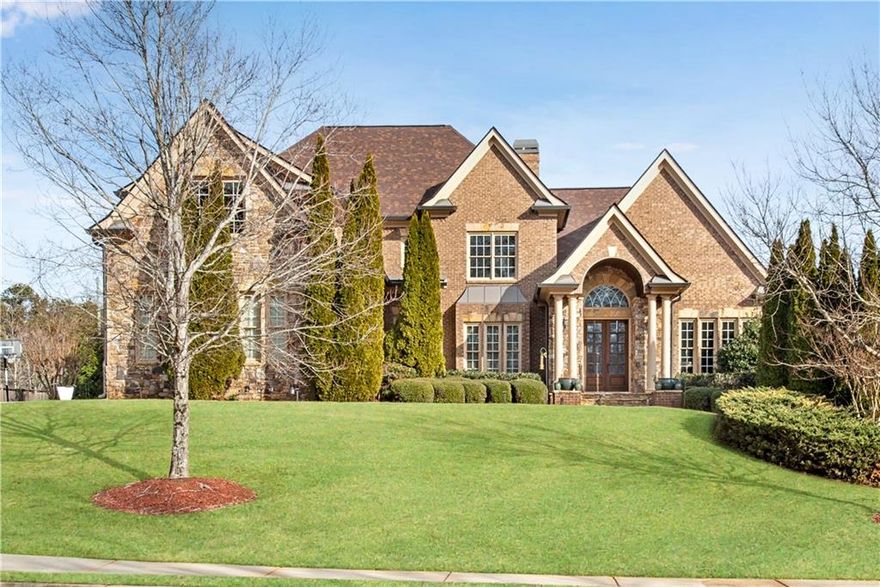 Welcome Home to this stunning all-brick and stone executive home perfectly situated in the sought after Hillgrove High School district. Boasting 6 spacious bedrooms and 5.5 luxurious bathrooms, this residence is the epitome of elegance and comfort.  Enjoy the convenience of a primary suite on the main level, complete with a sitting area, fireplace, luxurious bath with double vanities, and custom closets by California Closets. The main level features a grand 2 story foyer, 2 story great room with a fireplace, office/living room with built-ins, formal dining room and a spacious laundry room with a sink and cabinets. The expansive kitchen features an extra large island, walk-in pantry, Stainless Steel appliances, double ovens, and a keeping room with its own fireplace, perfect for gatherings. Throughout the home, you'll notice beautiful trim, wide baseboards, and elegant crown molding, as well as high ceilings and doors. The second floor features 4 spacious bedrooms with good sized closets, and 3 full bathrooms. The Terrace Level is perfect for entertaining and comes with a bedroom, full bathroom, kitchenette, lots of storage space, an adorable art room, and a large open space perfect for a movie room, game room, office, or recreation room. Step outside to your private oasis featuring a resort-like heated pool, large covered porch, gas grill and beautiful landscaping and lighting around the pool. There is also a pool house with a half bath, storage space, and new roof. This wonderful home also features a 3 car garage, an electric car charger, fenced yard, CAT5e Ethernet, Nest thermostats, New Roof, New Water heater, 3 furnaces less than 4 years, smart controlled exterior lighting, central vac, and Blink security cameras for ultimate convenience and security. Come experience the perfect blend of luxury and comfort in Shearers Farm!