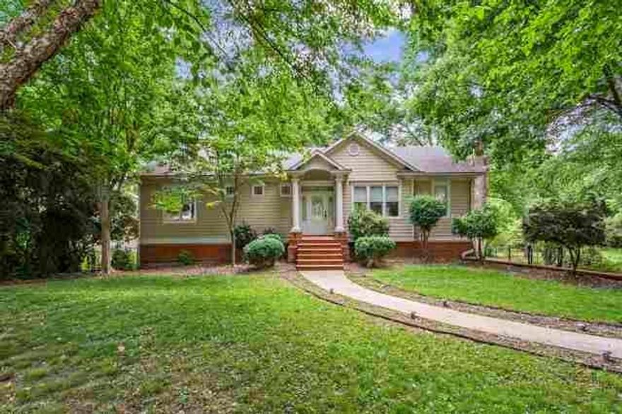 MOTIVATED SELLER!!! PRICE REDUCED TO SELL!!! SELLER PAYS $5,000 IN CLOSING COSTS!!! Opportunity in East Cobb!!! Great school district. Main level features 2 bedrooms and 2 bathrooms. There is an in-law apartment in the basement with 2 bedrooms, 1 full bathroom and kitchen. Many upgraded features, roof, air conditioner and water heater areless than 2 years old. There are hardwood floors and ceramic throught out the main level. The kitchen has stainless steel appliances, ceramic tile countertops and backsplash, custom stained cabinetry, over/under cabinet lighting and access to the deck. The family room has fireplace, custom built-in TV cabinet and access to the deck. The naster bedroom has custom walk-in closet, jetted tub and seoarate shower. The deck has a hook up for a grill, the backyard is fenced and has double gates for a trailer or boat. You must see it!!!