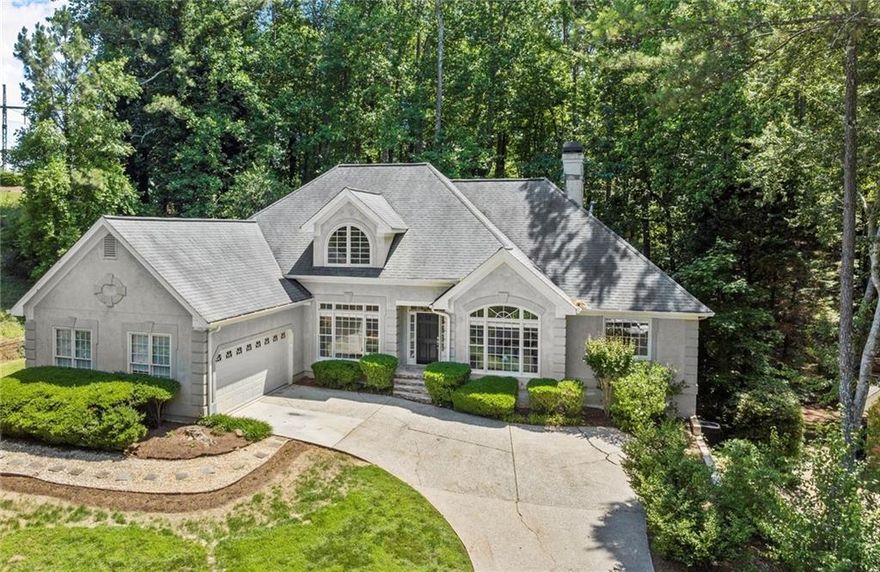 Welcome to this stunning hard coat stucco home located in the desirable Park Forest neighborhood, just minutes from Avalon and downtown Alpharetta. This property is situated in a top-rated school district and boasts access to a vibrant swim and tennis community.

Recently refreshed, the home features bright, fresh interior paint throughout, new carpet, and updated lighting, adding a modern touch to its elegant design. The main floor showcases hardwood floors, enhancing the inviting atmosphere.

As you enter the grand two-story foyer, you’ll be greeted by a formal dining room on one side and a spacious office/sitting room on the other, featuring gorgeous arched windows that fill the space with natural light. The heart of the home is an open and bright main living area that feels like you’re living in a treehouse, thanks to the breathtaking views of the private wooded backyard visible from every room.

The two-story living room, open to the kitchen, showcases soaring ceilings and beautiful skylight windows, inviting sunlight to pour in and enhance the warm ambiance. A beautiful stacked stone fireplace serves as the focal point of the room, flanked by custom shelving and cabinetry on each side, perfect for displaying books and cherished items.

The comfortable open kitchen with vaulted ceilings features white cabinets and elegant granite countertops, complemented by a charming breakfast nook that overlooks the serene backyard. Additional seating is available at the kitchen bar, perfect for casual dining and entertaining. The seamless flow between the kitchen and the living room creates an inviting atmosphere, making it ideal for gatherings and entertaining guests.

Retreat to the expansive primary suite, highlighted by tray ceilings and a private entry to the back deck, where you can soak in the peaceful surroundings. The primary bathroom offers a soaking tub, a separate stand-up tile shower, ample cabinet storage, and dual vanities for optimal convenience. You’ll also appreciate the well-organized his and hers closets, complete with custom cabinetry, ensuring plenty of storage space.

On the main floor, you'll find two generously sized secondary bedrooms, each with its own private vanity area, sharing a well-appointed Jack and Jill bathroom. The convenient laundry room, equipped with cabinetry and a utility sink, is located just off the two-car garage, which includes additional storage space.  Venture upstairs to discover a versatile bonus room that can be tailored to fit your needs—this flexible space could easily serve as an additional bedroom, complete with its own en suite bathroom. 

The full daylight basement is an incredible opportunity for customization, already framed and ready for your personal touch. Finish it to nearly double the square footage of your home, creating the perfect space for recreation, entertainment, or whatever your heart desires.

This home offers a perfect blend of luxury, space, and serene living, making it a rare find in such a prime location. Don’t miss your chance to make it yours!
