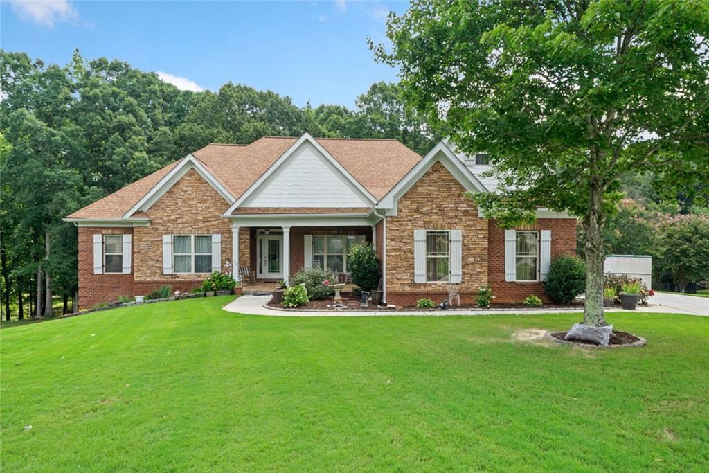 Resort-style living in Dacula! This stunning 5-bedroom, 4 bath home sits on 1.87 acres in the sought-after Spruce Creek community, complete with an inground pool and backyard oasis. The open concept living area features soaring ceilings, a cozy fireplace, and large windows for abundant natural light. The gourmet kitchen offers granite counters, a breakfast nook, and plenty of cabinet space. The main-level owner’s suite boasts a sitting area, fireplace, and spa bath, with two additional bedrooms on the main. Upstairs is a private bedroom and full bath, perfect for guests or a teen suite. The finished terrace level includes a spacious rec room, bedroom, and full bath with a walkout to the pool. All just minutes from top schools, shopping, dining, and commuter routes.