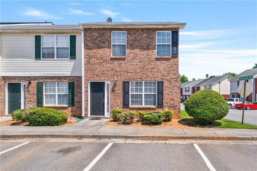 An exceptional opportunity awaits with this well-maintained townhouse, perfectly situated in an established Adairsville community. This property is an ideal fit for a first-time homebuyer stepping onto the property ladder or an astute income-producing investor seeking a dependable asset. This residence is thoughtfully designed with two spacious bedrooms and a highly desirable two and a half bathrooms across 1188 square feet, all on a manageable .05-acre lot that promises ease of ownership and a low-maintenance lifestyle.

The inviting brick and siding exterior welcomes you inside. On the main level, you'll find an intuitive floor plan built for everyday living. The comfortable family room is spacious and bright, offering a wonderful place for relaxation or gathering. Moving toward the back of the home, the practical and functional eat-in kitchen is equipped with ample wood-tone cabinetry, plenty of counter space for meal preparation, and classic white appliances. A dedicated dining area sits adjacent to the kitchen, and a convenient half-bathroom and laundry area complete the main floor.

Ascending to the upper level, you'll appreciate the privacy of the sleeping quarters. Both generously sized bedrooms are true retreats, designed to maximize comfort. Crucially, each bedroom benefits from the privacy and convenience of its own full, dedicated bathroom, making the layout perfect for roommates or a growing family. The bedrooms are easily personalized, with one featuring a cheerful blue accent and the other a calming sage green.

Beyond the interior, the property offers a simple patio area accessible from the kitchen, which extends your living space outdoors for enjoying the beautiful weather. The efficient design, accessible price point, and desirable location in Adairsville—close to local amenities and major routes—make this property a remarkable value. Do not miss this chance to own a great piece of real estate that balances comfort, convenience, and investment potential.