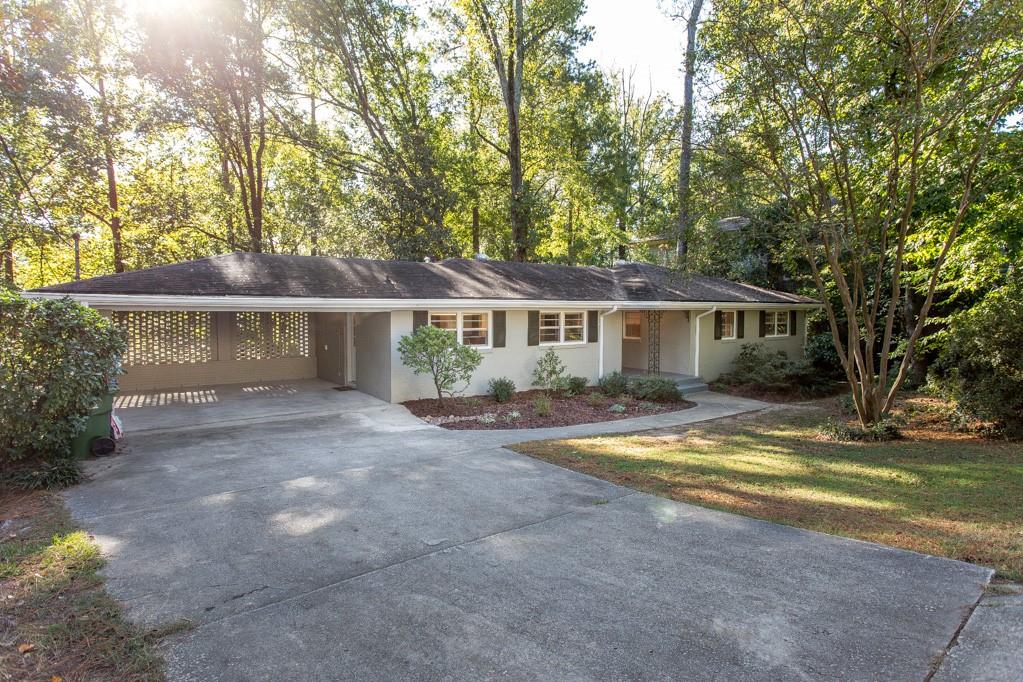 Ideal Buckhead Location – Walk to Sarah Smith Elementary!
This inviting two-story ranch-style home is perfectly situated less than a block from Sarah Smith Elementary and just minutes from the shops and restaurants of Buckhead, Brookhaven, Sandy Springs, and all major interstates. Outdoor enthusiasts will love the easy walk to the Path400 Greenway Trail, as well as quick access to Chastain Park and the Blue Heron Nature Preserve.
The main level offers ample living space with hardwood floors throughout, including 3 bedrooms and 2 full bathrooms — one of which is a renovated en-suite for the primary bedroom. The open-concept living and dining area flows into a renovated kitchen and cozy den, creating the perfect space for relaxing or entertaining.
Additional features include a two-car carport and a large, fenced-in backyard — ideal for outdoor enjoyment.
The lower level includes: A laundry area with washer, dryer, and an extra refrigerator/freezer. A spacious bonus room, perfect for a playroom, gym, or extra storage. A separate workshop area that can double as additional storage.
No smoking. Yard service is included in rent. Call regarding pets.