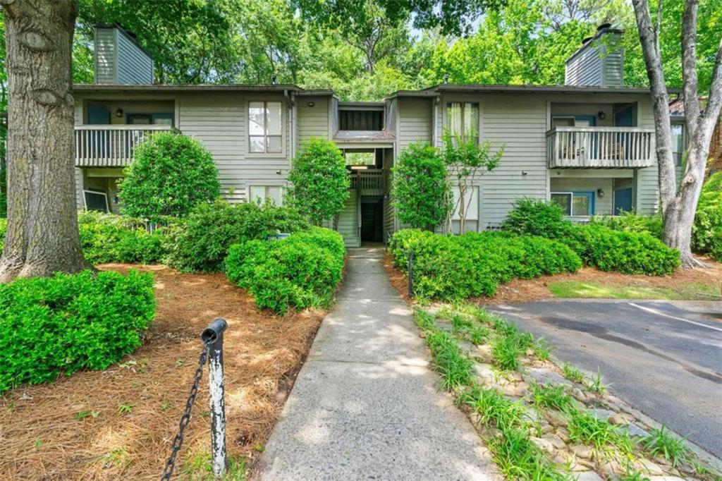 Tucked into a quiet, wooded condo community just outside downtown Decatur, this two-bedroom, two-bathroom home offers a low-maintenance lifestyle in a location that keeps you close to everything. With a smart roommate-style layout, both bedrooms sit on opposite sides of the unit and have direct access to a bathroom, ideal for shared living, guests, or a quiet work-from-home setup. The living room feels open and inviting, thanks to a vaulted ceiling and a wall of windows that brings in soft natural light. Just off the living area is a dedicated dining space and a separate laundry room for convenience. A brand new AC unit was recently installed, and the private balcony looks out over a quiet, wooded view, one of the many details that give the home its easygoing, relaxed feel. The community itself is shaded by mature trees and professionally landscaped, giving it a peaceful, park-like setting. Grocery stores and restaurants are just across the street, and Medlock Park is a few blocks away. Emory University is just minutes from the front door, and even better, an Emory shuttle stop is just down the street, offering free rides to campus and making this location especially convenient for anyone commuting to the Clifton Corridor. Downtown Decatur is just over a mile away, with MARTA access, local festivals, and some of the best food and coffee shops in Atlanta. Whether you're looking for a comfortable home base or a rental-ready investment, this condo makes life simple, and that's what makes it special.