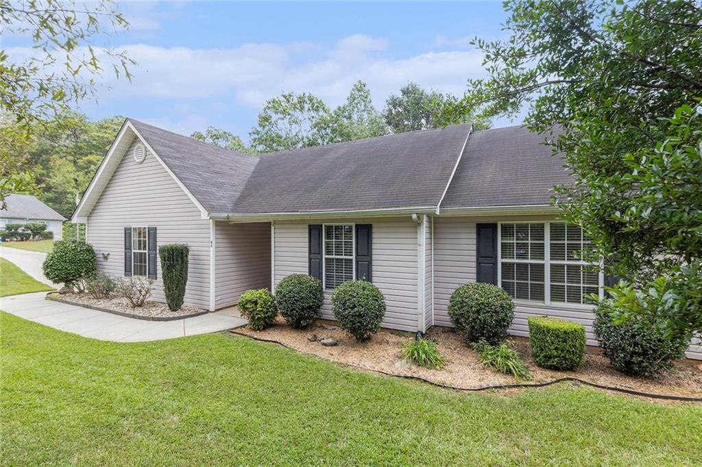 Welcome to this beautiful ranch-style home nestled in a quiet, well-established neighborhood in the heart of Newnan. Situated on a spacious corner lot, 49 Virginia Heights Drive offers both privacy and convenience, just minutes from downtown Newnan, Ashley Park, Piedmont Newnan Hospital, and easy access to I-85.
This thoughtfully designed home features an open floorplan with seamless flow and durable laminate flooring throughout. The large, sun-filled kitchen boasts abundant natural light, ample counter space, and cabinetry, perfect for cooking, entertaining, or simply enjoying your morning coffee.
You’ll love the oversized laundry room with extra space for storage or hobbies, plus the attached 2-car garage for added convenience. The three bedrooms are ideally located close to each other. The primary bedroom includes an en suite bathroom for added privacy and comfort.
Step outside to enjoy a yard designed for both relaxation and functionality, whether you're into gardening, hosting friends, or just soaking up the peaceful surroundings, this space has it all. Mature landscaping provides natural privacy, and the corner lot enhances your outdoor enjoyment.
Don’t miss this opportunity to own a low-maintenance, move-in ready home in one of Newnan’s most desirable areas. Schedule your private tour today!