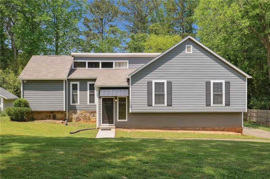 Spacious and beautifully updated home, ideally located in a quiet cul-de-sac within the highly desirable East Cobb with so many NEW features and improvements. This home offers comfort, flexibility, and modern upgrades throughout. The main level features a large, light-filled family room with vaulted ceilings and a fireplace, a separate formal dining area, a kitchen with granite counters and an abundance of cabinets, and a breakfast bar that leads into the bright breakfast nook.  This home is perfect for both entertaining and everyday living. Just off the kitchen area, relax on the screened-in porch, which overlooks a private, large, level backyard. The owner's suite provides a peaceful retreat with a renovated en-suite bathroom with dual vanities and a tiled shower.  Two additional bedrooms offer ample closet space and access to a stylishly updated hall bath. The fully finished lower level presents an excellent opportunity for an in-law or teen suite, complete with its own private entrance, additional bedroom and full bath, bonus living space (or home office), and an oversized 2+ car garage that includes a workshop area—ideal for storage, hobbies, or projects. This home is loaded with major improvements, including a new roof (2021), new exterior paint, siding, and windows (2022), new flooring and fully renovated bathrooms (2022), new laundry room with cabinets and sink (2022), new water heater (2023), updated plumbing and electrical systems (2021), and fresh interior paint (2025). With all the big-ticket updates already completed, this home is truly move-in ready.