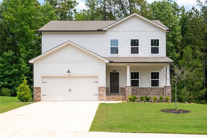 Built in 2023, this like-new home has everything you've been searching for! Nestled in the sought-after Brookstone West community and within the highly rated North Paulding High School District, this home features 4 bedrooms, 2.5 baths, and a generous 0.43-acre lot. Enjoy the covered rear porch that overlooks a peaceful wooded backyard, plus an unfinished basement that's ready for your personal touch. As you enter, you're welcomed by an office/flex room, ideal for work or relaxation. From there, step into a bright, open floor plan where the family room is highlighted by a stunning fireplace with a mantle, creating a warm atmosphere. The chef-inspired kitchen is a true showstopper, featuring an island, white cabinetry, quartz countertops, and stainless steel Whirlpool appliances, it's perfect for both everyday living and entertaining. The open layout flows effortlessly into the dining area/eat-in kitchen, and beyond, to the covered rear porch where you can enjoy the private backyard. Upstairs, you'll find a spacious loft offering versatile living space, along with generously sized secondary bedrooms & secondary bathroom with double vanities and a tub/shower combo. The master suite serves as a peaceful retreat, complete with a luxurious ensuite bath featuring double vanities, a separate tiled tub and shower, and a large walk-in closet. The unfinished basement presents endless possibilities for customization, whether you're looking to expand your living space or create the perfect home gym or theater. Built with energy efficiency in mind, this home includes EPA Indoor airPLUS certification and a RHEIA air duct system, ensuring comfort and savings. Located in a prime area close to shopping, dining, entertainment, schools, parks and trails, it's truly a place to call home. Brookstone Golf & Country Club offers Swim/Tennis membership to Brookstone West residents, which runs from June 1 to May 31 for $395/year. **Reduced Costs Option: With Preferred Lender, receive up to $3000 credit toward closing costs OR Temporary 1-Year Buydown.