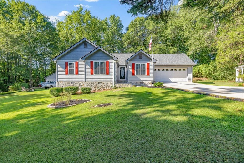 Nestled on 1.72 acres with no HOA, this immaculately maintained Ranch Home offers privacy, charm and true move-in readiness. Surrounded by mature trees and beautifully landscaped grounds, you’ll be captivated by the serene setting featuring a manicured lawn, professional landscaping, and a charming gazebo - all setting the tone for a home that clearly reflects thoughtful care and pride of ownership. This 3BD/2BA home offers inviting warmth and timeless appeal, featuring spacious bedrooms, hardwood floors, fresh interior paint, and a layout that flows effortlessly. Enjoy meals in the eat-in kitchen with crisp white cabinetry, white appliances, a modern backsplash, and a new dishwasher, or entertain in the formal dining room and expansive family room with plenty of space to gather and relax. Both bathrooms have been fully updated with modern tile, fresh cabinetry, new fixtures, and designer finishes. New roof on home, detached garage, and gazebo. Shed offers additional storage. Don’t miss the chance to own a truly special home where pride of ownership shines through every detail. Schedule your private showing today – homes like this don’t come along often!