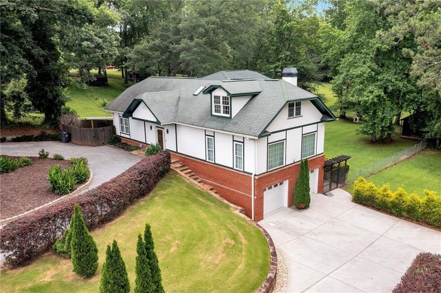 This captivating custom-built home flooded with natural light, is ready for immediate occupancy. Totally rebuilt between 2011-2014, second floor – new finished April 2024. The home boasts tiled and hardwood floors and natural sunlight bathing the interiors. Moving into the main living area and kitchen, you'll enjoy all the benefits of an open-concept modern kitchen with stainless steel appliances, quartz countertops, a large island, a pantry, lots of storage space, and a dining area. The kitchen opens to the spacious, oversized living room with abundant natural light, a wood-burning fireplace for cozier days, and a hardwood floor. You will find one full bathroom and two bedrooms on the other side of the main floor. The second floor features an oversized master suite, a perfect blend of modern elegance and timeless charm, offering a tranquil view of a beautifully landscaped yard. The basement is finished and features a bedroom, full bathroom, and three additional areas, which can be used as a game area, kitchen, small living area, or fitness area. The basement has direct access to the two-car garage. Moving to the backyard is a delight with a tiled deck, fruit trees (2 figs and two peach trees), well in perfect working condition, connected for watering plants around the house, and plentiful gardening space or the possibility of installing a pool. The location of this home cannot be beaten - close to award-winning schools, downtown Alpharetta for shopping and restaurants, Halcyon, Avalon, Crabapple, and easy access to Windward and 400!