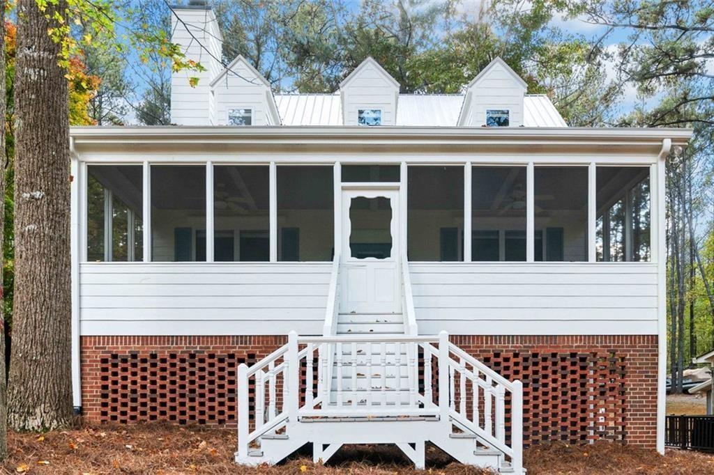 Rare Opportunity - No longer on CORPS Land!!– Fully Renovated Lake Allatoona Home with Private Deep-Water Dock! Don’t miss your chance to own this stunning, fully updated lakefront retreat on Lake Allatoona, complete with a private deep-water dock and boat lift—all for under $600K! Properties like this are a rare find—Lake Allatoona has limited shoreline access with private docks, making this home a true gem. This beautifully renovated home offers breathtaking lake views from the main-level owner’s suite and both upstairs bedrooms. A spacious screened-in porch provides the perfect spot to relax and enjoy the natural beauty and soothing sounds of the water year-round. The kitchen features modern updates, including brand-new stainless-steel appliances, crisp white cabinetry, and fresh paint throughout. The main level boasts warm hardwood floors, while new carpet in the bedrooms adds comfort and coziness. Conveniently located just minutes from I-75 and only 10 minutes from Downtown Acworth, this home offers the perfect blend of lakeside serenity and accessibility. Enjoy direct access to deep, open water—ideal for boating, fishing, kayaking, water skiing, and wakeboarding. The private community also includes a boat ramp and seasonal boat parking right outside your door—saving you the cost and hassle of marina slip fees.