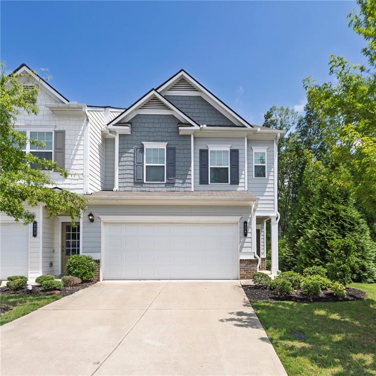 End-unit townhome located in the small and quaint community Parkside East. Step inside to a light-filled, open-concept main level featuring a cozy fireplace in the living room and a spacious kitchen with an abundance of cabinetry and countertop space, perfect for both everyday living and entertaining. The extra-wide staircase is a standout feature, drenched in natural daylight and adding to the home's open, airy feel.
The extra wide staircase leads upstairs where you will find high ceilings, fantastic natural light in every room, and a small sitting area. The generous primary suite offers a relaxing retreat with the bathroom features include double vanities, a walk-in shower, separate soaking tub, and a custom-designed closet system in the walk-in closet. Two additional bedrooms, a spacious laundry room (washer & dryer included!), and well-appointed secondary bathroom complete the upper level.
Enjoy outdoor living on the oversized back patio with privacy fence panels on each side and serene views of the surrounding green space behind the home and a line of trees on the side which may cause you to forget you have neighbors. Additional features include overhead storage in the 2 car garage with an auto-opener. Ideally located in southern Canton with easy access to I-575, shopping, dining, and more.