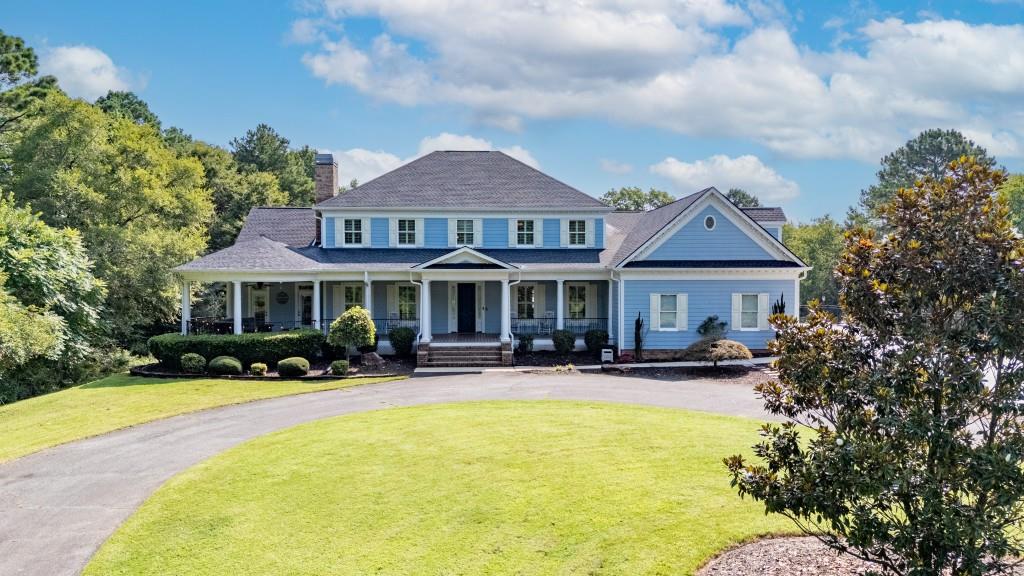 Private estate in country setting offers proximity to "town" and a quiet retreat when at home! If a blend of country and convenience is what you seek, this custom built home on 9 gorgeous acres in a rural section of Bartow may be the perfect fit. Leave the worries of the workday behind as you wind up the private driveway (please do not come up driveway without an appointment) and arrive at this 4600+ square foot traditional home positioned among a mix of woods and mature landscaping. The wide front porch welcomes all, providing space for rocking chairs and a sitting area under the gazebo style roof on the west end of the home. Step into the soaring foyer with gleaming tile floors and choose whether to enter an impressive office with custom built-ins and the first of two wood burning fireplaces, a formal dining space, or the living room, all with warm hardwood floors. The sweeping front staircase and paneled-ceiling hallway passage show off this two story home's charm and character. Large windows throughout the home allow natural light to fill the rooms. From the sunny living room, split off one direction to the large eat-in kitchen or the other to one of TWO primary suites this home has to offer. The downstairs owner suite features a large trey-ceilinged bedroom with back porch access (the pool is steps away!) and a classically outfitted bathroom with double vanity, separate tub and tiled shower - but the real hallmark of this suite is the massive walk-in closet with front porch access! Traversing back down the hallway, stop momentarily to take in the generously sized laundry room also with back porch access. Admire the built-ins and fireplace of the living room (see the balcony above?) and head into the over-sized kitchen where meal prep will be a dream with stone counters, a large breakfast bar with seating, soaring solid wood cabinets, and a stylish and practical tile backsplash. The stainless steel set of appliances completes this clean and beautiful kitchen. Amble out to the pool from either the breakfast nook or from the hallway adjacent to the kitchen. Off this handsomely tiled hallway you'll find backyard access, a convenient half-bath which pool partiers can use without tracking wet footprints through the house, garage access, and the rear stairway. Follow those stairs up to the massive bonus room, already showcasing the amount of room available for games or movie viewing. Atop the second floor find two more large bedrooms which share hall bath access with a double vanity and tub shower combo. At the end of the hallway (you won't miss the chance to peer down into living room from the balcony) sits the second of the home's primary suites. Another generously sized bedroom leads into a 4-piece bath, but a secret lies within this seemingly straightforward bathroom: enter the closet and discover ANOTHER fully finished space beyond the closet, sure to inspire the creativity of this home's next owner. This could be an office, a dressing room, art/podcast studio - your imagination is the limit! Also accessible from this space is additional unfinished attic storage. With all this house to see it's easy to forget there's a beautiful backyard to explore! Summer days were made for this back porch with pool and lush lawn! And the wrought iron fencing ensures pets have a safe space to roam without being tempted to explore the whole 9 acres. This home is a treasure which needs to be seen to be appreciated! All information deemed reliable but should be confirmed by buyer.