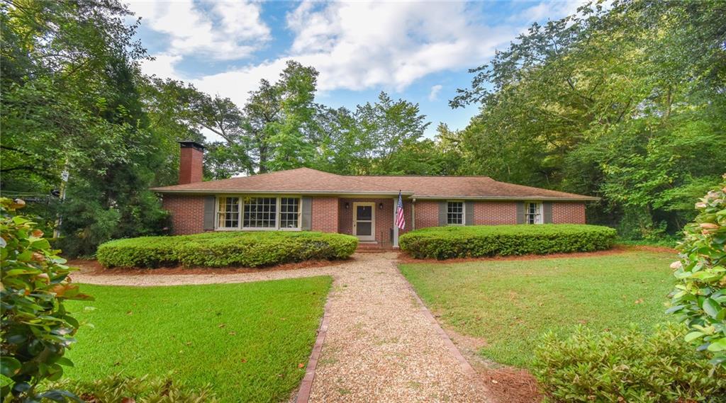 Thoughtfully Updated 1951 Brick Ranch in the Heart of Historic Marietta.
Welcome home to timeless charm and modern comfort just a short stroll from the lively Historic Marietta Square. Nestled in the sought-after Whitlock Avenue Historic District, this beautifully updated 1951 brick ranch sits on a full basement and offers the kind of lifestyle that’s getting harder and harder to find—walkable, vibrant, and full of character.
On the main level, you’ll find three spacious bedrooms and two full bathrooms, each updated with care to preserve the home’s original charm while offering the comfort and functionality of today. The chef’s kitchen is truly the heart of the home, featuring custom cabinetry with pull out cabinet drawers, thoughtful design, and space for gathering with friends or family.
Downstairs, a fully equipped studio apartment with its own kitchen and full bath offers endless possibilities—multi-generational living, an income-producing AirBnB or long-term rental, or even the perfect work-from-home space with separate exterior access so clients or guests never need to enter the main home.
Step out back and you'll find a peaceful, private retreat. A fountain trickles in the background while a fire pit invites cozy evenings under the stars. In the spring, the yard bursts into color with blooming azaleas—truly a sight to behold.
And the best part? You’re just minutes from award-winning restaurants like the Michelin-starred Spring, local breweries, museums, galleries, and the historic Strand Theater. Stroll to the weekly farmers market, take in live music on the Square, or explore Kennesaw Mountain’s trails just a short drive away. With sought after Marietta City Schools, quick access to I-75, and all the charm of a tight-knit, historic neighborhood where people know their neighbors, this home offers the best of both worlds—small-town walkability with big-city convenience.
These are not your typical updates. There’s no trendy white-on-white here—just authentic craftsmanship, timeless finishes, and a deep respect for the soul of the home. Whether you're looking for a forever home, a smart investment, or a unique live/work setup, this one checks all the boxes.
Don’t miss your chance to own a piece of Marietta history—schedule your private tour today.