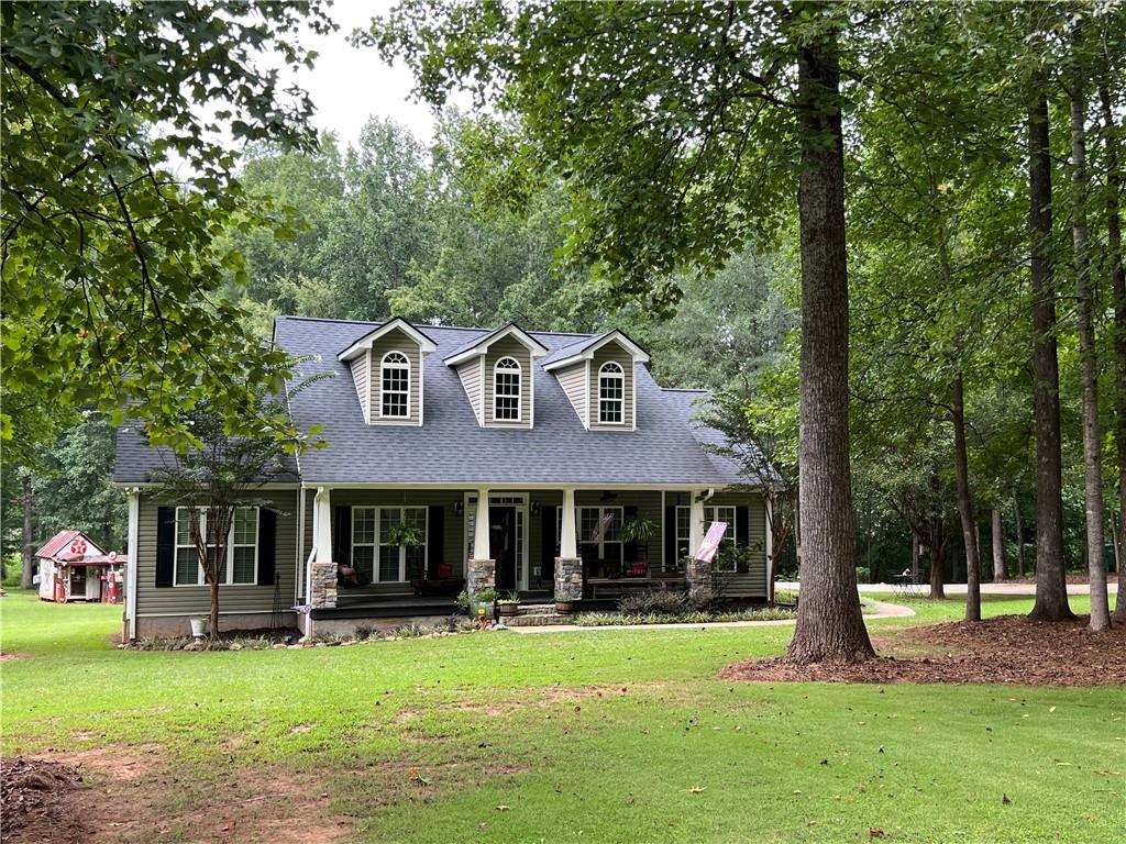 Beautiful Custom Built Home sitting on a private 3.29 acre lot. 3 Bedrooms, 2 1/2 Baths, Open floor plan with a huge master suite, soaking tub, double vanities and his and her walk in closets. Open Kitchen with an extra large island for a work space and seating and a large breakfast nook overlooking the front yard, walk-in pantry, separate laundry room, Two additional spacious bedrooms and an unfinished bonus room for expansion or storage. Cozy Fireplace in Family Room, double french doors leading out to the back deck. Large Covered Front Porch, Roof Replaced in 2023. 8 miles to Jefferson, 12 miles to I-85 , 18 minutes to Athens, No HOA!