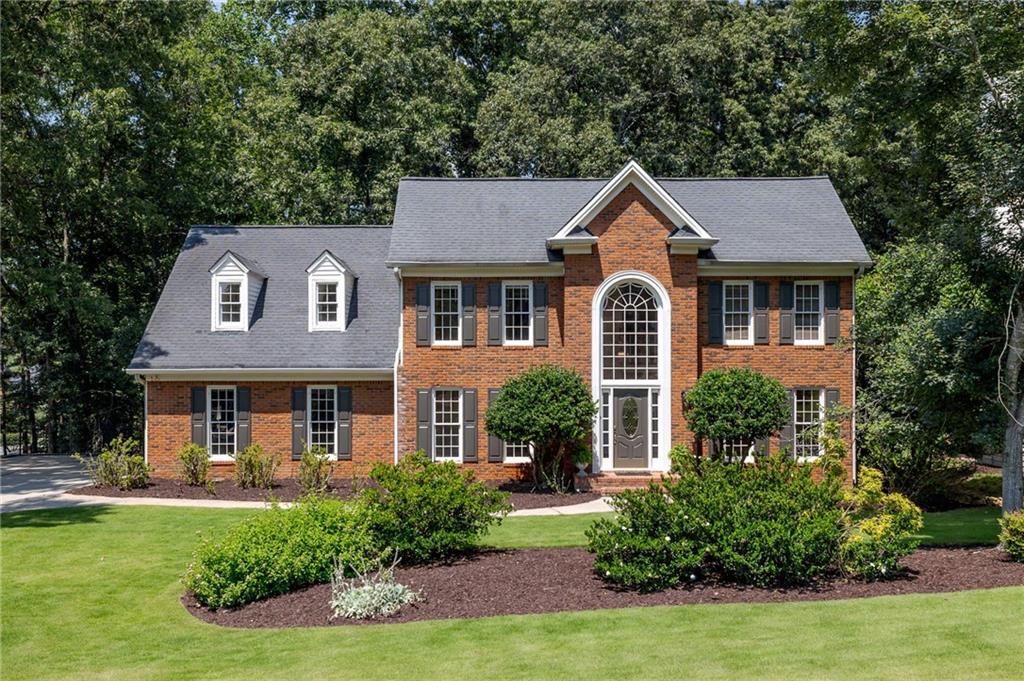 With a price improvement, your search for an affordable home in the Dolvin, Autrey Mill, Johns Creek HS district is over. This home in the Desirable swim/tennis neighborhood of Waters Mill has been lovingly cared for by its original owners. Now, with brand new top of the line laminate on the main floor and brand new carpet upstairs, this home is perfect for a growing family. This house needs to be seen to be appreciated especially because of its location. It will be a great investment in what will be your forever home.
Upon entering, you are greeted by a 2 story foyer. Make your way into the 2 story family room with expansive views to the deck and natural beauty of the backyard. The large eat-in kitchen is equipped with GE Profile appliances including a brand new microwave and a brand new Samsung refrigerator, real wood cabinets, granite counter-tops tops and tumbled marble back splash. A laundry room with a utility sink and a walk-in pantry round out the main floor. The deck off the kitchen is the perfect place for relaxing and enjoying the sights and sounds of nature.
Upstairs there are 4 bedrooms, including a large master bedroom with a trey ceiling, updated master bath with Jacuzzi tub, Schluter Shower System, and lots of natural light. The secondary bedrooms are large and light-filled as well. On the second level all of the bedrooms, hall and stairs have brand new upgraded carpet installed July 2025.
The terrace level features an in-law suite with a full kitchen, living area, bedroom, walk-in closet, and large bathroom with laundry. This lower level is perfect for multi-generational families, a guest suite or as a place for your family to relax and entertain friends and family. The terrace level walks out to a patio, perfect for parties. This backyard is the perfect blank canvas for family fun! Both the back and front yards are equipped with a Hunter Pro irrigation system and professional landscaping including Zeon Zoysia sod in the front yard.
Waters Mill is a great family swim and tennis neighborhood with an active HOA. Taxes for this property are $2501, less than half of many of the homes in the area which means hundreds in savings each month. This home is also being offered with a Max Plan First American Home Warranty so there are no worries when it comes to your appliances and systems. This is a must-have home. Don’t delay!