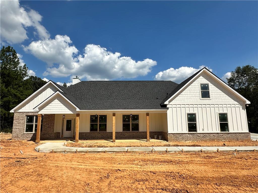 Gorgeous 4 bed/3 bath craftsman home with stunning trapezoid windows nestled on 3 acres in a charming one cul-de-sac neighborhood. This new construction home in Kingston is just inside the Bartow County line. Step inside to a light, airy, and open feel provided by a gorgeous trapezoid window wall with beautiful tree lined rear property views providing an incredible private setting with plenty of room for a pool. This home features a welcoming roomy foyer including a shiplap wall, and coffered ceiling dining room overlooking an oversized great room with brick fireplace. The bright and cheery kitchen is perfect for daily family gatherings and entertaining with a nice sized island/eat-in, quartz countertops, cabinets galore, and stainless steel appliances. On the main floor you'll find a spacious master bedroom with separate shower and soaking tub, double quartz vanities, a massive walk-in closet, as well as two large bedrooms and one full bath. Upstairs is a huge bonus bedroom including its own full bath and walk-in closet. Additional features include custom upgraded lighting, oversized utility/mud room, nice sized laundry room, side entry garage, extensive hardwood laminate flooring, crown moulding, and large front and rear covered porches, including ceiling fans. This home is one of many new construction craftsman style luxury homes on a picturesque and peaceful road -- a beautiful overall setting. The Stratford Community is conveniently located near Rome or Cartersville shopping, restaurants, and entertainment. Estimated completion date early November 2025.