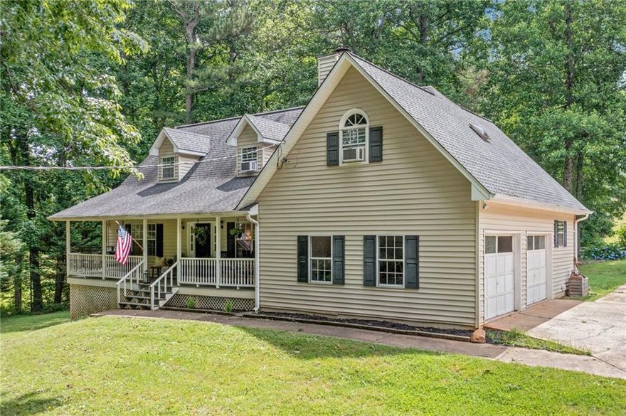 Welcome to this charming farmhouse nestled on just under 5 acres—a perfect blend of wooded privacy and rolling pasture in the heart of the beloved Clayton community. Whether you're dreaming of goats, chickens, garden beds, or just room to roam, this property delivers. Step onto the covered rocking chair front porch and into a home full of warmth and character. Freshly painted throughout, the interior features beautiful hardwood floors and an updated kitchen with white cabinets, granite countertops, and plenty of space to gather. The main-level primary suite offers a peaceful retreat with a walk-in closet, double vanity, and a relaxing soaking tub. Upstairs, two cozy bedrooms share a full bathroom, while an additional bedroom or bonus room off the laundry room creates the perfect space for guests, a home office, or a playroom—whatever your lifestyle needs. Outside, a flat backyard is ideal for entertaining or playing, and the fenced rolling pasture has been home to goats, pigs, chickens, and even turkeys. Garden planters are ready for your green thumb, and just through the woods, you'll find Weatherby Park with baseball fields, batting cages, walking trails, and a playground. Tucked away in a quiet, tight-knit community yet minutes from all the shopping, dining, and amenities of Riverstone Parkway—this one is the dream you’ve been waiting for.