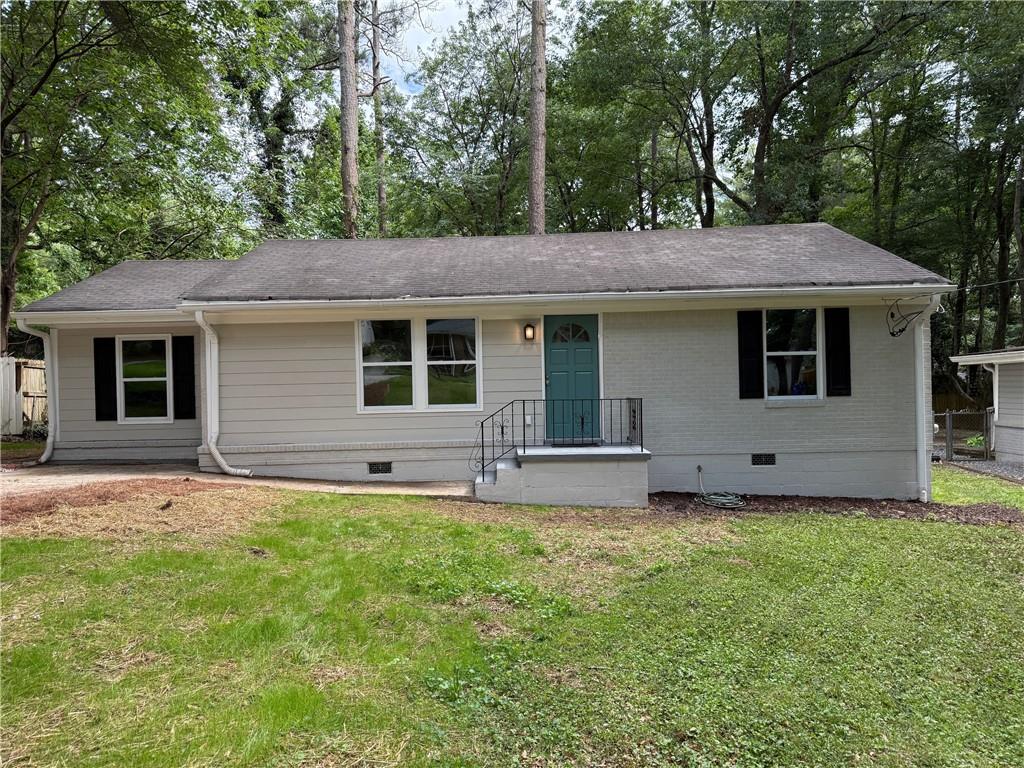 Charming brick ranch close to everywhere you want to be in Decatur! This home features plenty of updates including new roof, new heating and air, new bathrooms and kitchen, freshly painted inside and out, new plumbing, new electrical, new water heater and more! The bright kitchen has been recently updated with luxurious granite countertops that exude sophistication and boasts a spacious island, perfect for both meal preparation and casual dining. New stainless steel appliances add a touch of contemporary style, while the eat-in breakfast area invites you to enjoy your morning coffee in comfort. Gleaming hardwood floors, this open concept home is perfect for family gatherings and entertainment. The deck overlooks a fenced, level backyard that can be your private sanctuary or place for entertaining friends and family. Nearby, the new Lula Hills Development is already underway! Just inside the perimeter and Stone Mountain Freeway and minutes to Downtown Decatur, Downtown Atlanta, Avondale Estates and Emory university. Come see this one today!