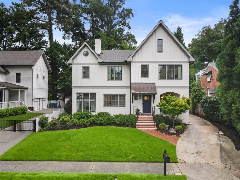 Welcome home to 790 Highland Terrace in the heart of Virginia Highland! Fully renovated in 2020 by Level Craft, this home maintains the character of Virginia Highlands while catering to modern conveniences. Immediately from the street you will notice the charming french doors with "pocket porch" and original stained-glass window. Step inside to a welcoming entrance foyer with built-in shelving, perfect for organizing everyday essentials. The spacious family room features original architectural details, including classic built-in bookshelves and a cozy fireplace—ideal for relaxing or gathering with loved ones. Just off the family room, a light-filled sunroom offers flexible space to suit your lifestyle—whether you're envisioning a home gym, office, or playroom. The renovated kitchen is a showstopper, boasting soaring ceilings, quartz countertops, a farmhouse sink, stainless steel appliances, a gas range and hood, and a large central island. Two seperate doors lead from the kitchen to a covered outdoor deck overlooking a flat, grassy backyard, creating a seamless indoor-outdoor flow, ideal for entertaining. A large dining room is conveniently accessed from both the family room and kitchen. The main level guest suite offers privacy and convenience with access to a full bath from both the bedroom and hallway. Upstairs, the owner’s suite is a peaceful retreat with his and hers closets, a spa-like bath featuring dual vanities, a private water closet, and a large walk-in shower. Two additional bedrooms with oversized closets share a Jack and Jill bathroom with dual vanities and a tub/shower combo. A stylish laundry room with charming tile and ample storage completes the upper level. Walkable to downtown Virginia Highland, Morningside Village, Orme Park, Piedmont Park, and the Beltline. With thoughtful upgrades throughout, charming details, and a seamless floor plan, this home is a must-see.!