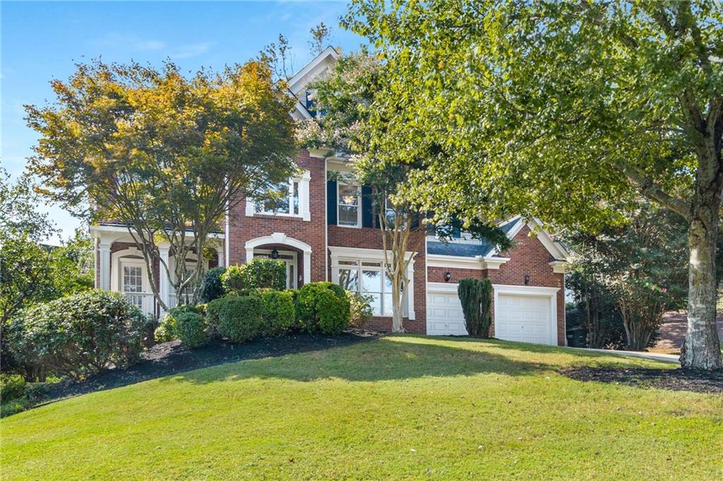 Spacious Executive Home in East Cobb's highly sought after Christopher Robbins Neighborhood! This large home features 6 bedrooms & 5 full bathrooms with oversized living spaces. Enter through the grand 2-story foyer entryway leading to a versatile formal dining & formal living or flex space for office. The foyer leads into the light-filled dramatic soaring ceilings in the family room with stone surround gas fireplace with floor to ceiling windows. The family room flows seamlessly into the heart of the home-The kitchen, which features abundant white cabinetry, gas cooktop, double ovens, walk-in pantry, sleek stone countertops, center island with additional seating. Adjacent to the kitchen is a spacious breakfast area offering serene views of the backyard.
The main floor also features a private guest bedroom suite and full ensuite bathroom. Venture upstairs and you'll find an Expansive primary suite with light-filled seating area & Relax in the luxurious spa bathroom with a jetted soaking tub, separate shower, private water closet, and an oversized walk-in closet. This thoughtfully designed home offers 3 more large secondary bedrooms upstairs with two split-bedroom layout sharing a Jack and Jill bath plus 1 more bedroom with its own full ensuite bathroom. The finished terrace level In-Law Suite features a Full Kitchen & Bath, Bedroom, Living Area, Separate Washer/Dryer and Private Driveway Access and separate garage. That's 3 Car Garage Total! This home has Fresh Interior Paint & New Carpet in family Room & All throughout upstairs. This Beautiful Stately Home sits on a Large corner lot on quiet cul-de-sac with fenced backyard. Enjoy easy access to neighborhood amenities, including a playground, clubhouse, a pristine pool, and tennis courts for staying fit and social. If you need space, this is the home for you. Come see this Gem for yourself.
