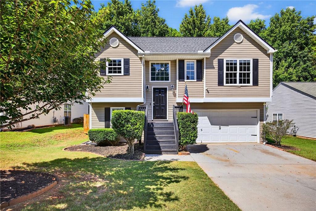 Welcome to 2216 Serenity Drive in Acworth! This 3-bedroom, 2-bathroom home combines modern comfort with a prime location just minutes from Wade Green Road and the heart of Kennesaw. You’ll love the easy access to an array of shopping, dining, and everyday conveniences—whether you’re grabbing groceries, enjoying local restaurants, or heading to Town Center Mall. Inside, the home features a bright, open layout with hardwood floors flowing into a spacious living room complete with vaulted ceilings and a cozy fireplace. The kitchen is outfitted with stainless steel appliances, sleek cabinetry, and contemporary finishes. The primary suite offers ample closet space and a private en-suite bathroom. On the lower level, you'll find an additional 2 bedroom, a full bathroom, laundry, and a 2 car garage. Out back, enjoy your own private retreat with a newly built two-level deck and multiple outdoor living spaces, perfect for entertaining or relaxing. The fenced backyard provides both privacy and room to play. With quick access to I-75, this home offers the perfect balance of convenience and comfort. Don’t miss your chance to make it yours!