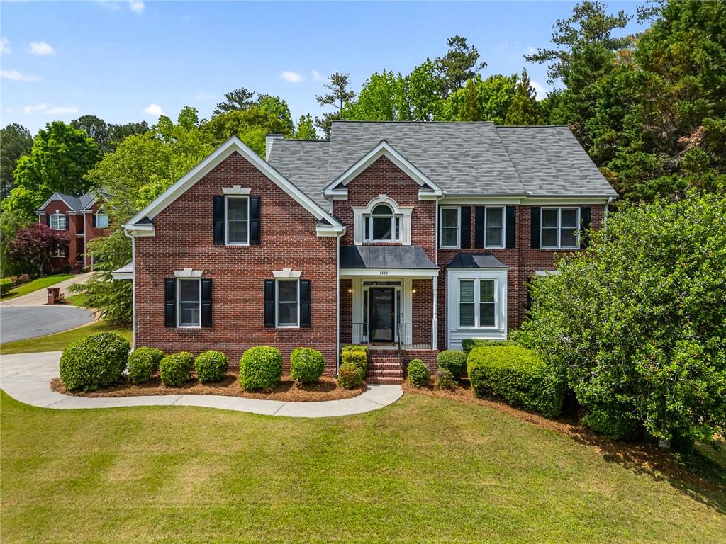 Located on a quiet cul-de-sac in Brentwood Park—a sought-after swim and tennis community in East Cobb—this 5-bedroom, 3.5-bathroom home offers comfort, space, and timeless style. The two-story foyer leads to a welcoming sitting room and an elegant formal dining room, perfect for entertaining. The fireside living room flows seamlessly into a bright kitchen, complete with newly installed matte granite countertops, abundant cabinet storage for any kitchen appliance imaginable, a walk-in pantry, and a breakfast nook with views of the back yard. Just off the kitchen is a well-appointed laundry room with additional storage. Throughout the home, you'll find beautiful hardwood floors, updated light fixtures, and a 1 year old water heater. Head out onto the private screened-in porch to enjoy your morning coffee or unwind in the evening. The adjacent back deck overlooking the level backyard offers the ideal spot for outdoor summer grilling. Plus there’s a newly renovated powder room, conveniently located away from the main living space. Upstairs, the oversized owner’s suite features a tray ceiling and a spacious ensuite bathroom with dual vanities, new quartz countertops, a whirlpool garden tub, a separate shower, and generous double walk-in closets. Three additional bedrooms and a dual-entry bathroom with separate new quartz vanities complete the upper level. If that wasn’t enough square footage, the finished basement provides flexible living space ideal for an in-law suite, featuring a den, a rustic bedroom and bath adorned with beautifully stained shiplap walls and ceilings. There’s also ample unfinished space for storage, hobbies, or a workshop. Neighborhood amenities include a clubhouse, pool, tennis and pickleball courts, a playground and multi-sport court. Easy access to I-75, GA-120, Marietta Square, shopping, restaurants and cafes!