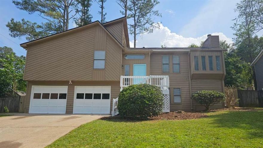 Don't Miss This Incredible Opportunity in East Cobb! Step into this beautifully renovated 4-bedroom, 2-bath home nestled on a quiet cul-de-sac just minutes from shopping, dining, and convenient highway access. The home is located within walking distance to Kell High School. With a newer roof (just 1 year old) and five brand new front-facing windows on the way, this home combines style with peace of mind. Inside, enjoy fresh neutral paint, updated lighting, and modern flooring throughout. The spacious, open-concept layout features a warm and inviting great room with a stone fireplace, flowing seamlessly into the dining area—perfect for entertaining. The renovated kitchen boasts sleek stainless steel appliances and ample cabinetry. Retreat to the oversized primary suite with an updated en-suite bath, while three generous secondary bedrooms offer ceiling fans and plenty of space. Both bathrooms have been tastefully remodeled with modern touches. Step outside to a sprawling back deck, ideal for gatherings, overlooking a fenced backyard - room for a pool, a great space for pets, play, or relaxation. The 2-car garage features freshly painted floors. This move-in ready gem checks all the boxes—schedule your private tour today!