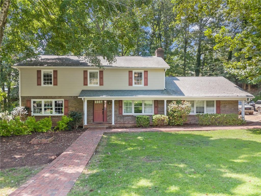 Traditional home in the heart of Gainesville that is close to the lake and has no HOA! This property is easy to access yet off the beaten path so there is not a lot of traffic to deal with. There is currently a make-shift 5th bedroom on the main level which is converted from a dining room. You could maintain it as a 5th bedroom or convert it back to its intended use. Cozy fireplace in the Great Room for evenings watching TV or just hanging out. Bathrooms are updated and roomy. Come check out this wonderfully located home and make it your own.