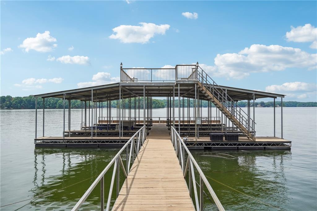 Bring your choice of builder and start your dream lake retreat in one of the well established lake neighborhoods. 3.6 Acre Deep-Water Lot In A Very Private Luxury gated Community with the luxury properties on Lake Lanier. 265 FT Of Corp/Waterfront Footage, All City Utilities available , Covered Six Slip Community Dock With Party Deck On Top. There is an easy walking path to the dock. 1 Dock Slip Included In Sale. Total of 3 Lots Available, From 2-6 +/- Acre Each, 1 Dock Slip Included With Each Lot. Quick and easy interstate access and located only 5 minutes from the shops and restaurants in downtown Gainesville.