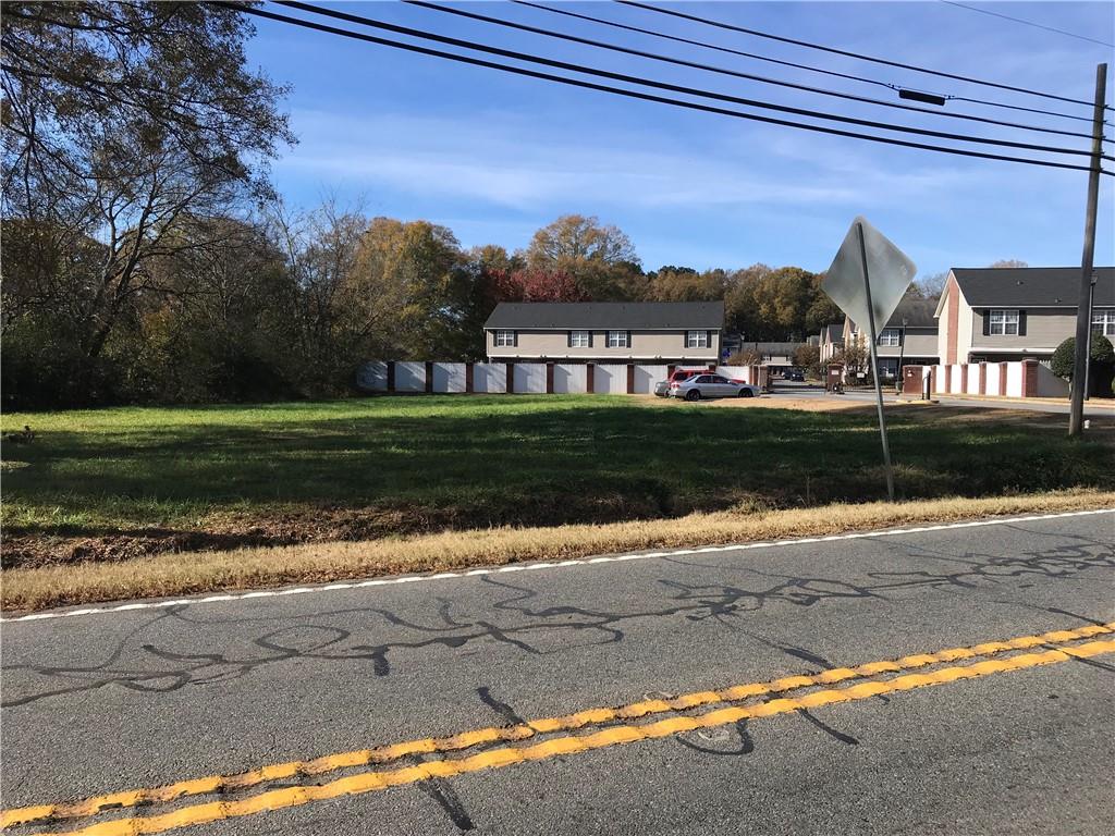 Commercial lot located on Cassville Road just north of Cartersville. Approved development plans for 3,200 s/f building. Driveway entrance approved. Water tap and sewer tap in place. Retention pond in place. Level topography. Ready to build.