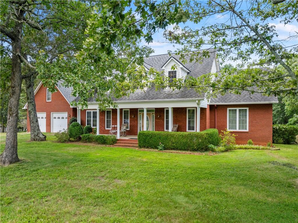 This solid brick home offers over 6,000 sq ft under roof and sits on over 10 acres, including a 1.75-acre bonus lot with a double wide mobile home. The main level is move-in ready with a spacious main suite, kitchen, family room with fireplace, sunroom, office, and more. Upstairs features 3 large bedrooms, finished and unfinished baths, and bonus space. The full unfinished basement includes a fireplace, workshop, and boat door. With an oversized 2-car garage, attic, and bonus room over the garage, this property offers space, potential, and room to grow. Parcels 12032 000030 and 12032 000024 make up the acreage