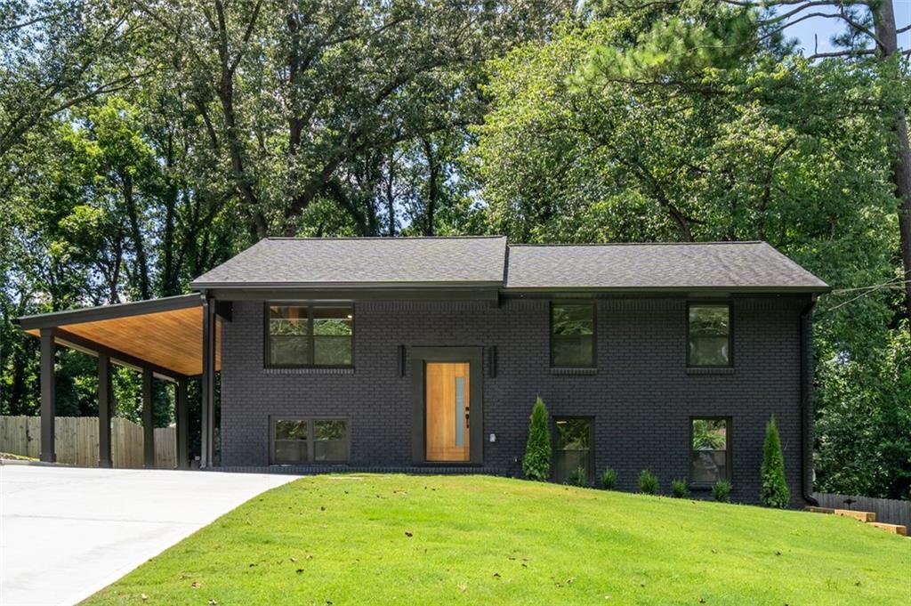 Step into this beautifully renovated home where no detail has been overlooked. FULLY PERMITTED renovations include a new electrical, plumbing, and HVAC, essentially everything is brand new. The upstairs features a stunning high vaulted ceiling in the main living and kitchen area, creating an open and airy feel. The kitchen is outfitted with custom cabinetry, quartz countertops with an island, and a large bar window that opens to a massive 500 sq. ft. deck, half covered and half open, with stair access to the backyard.
Inside, LVP flooring runs throughout, while each bathroom is finished with luxury large-format tile and light-up niches. Two of the three bathrooms include double vanities, and the oversized master suite offers a spacious walk-in closet and private access to the deck. Downstairs, enjoy a second oversized living area and a generous walk-in laundry room.
Outside, the home is complete with a brand-new double-wide driveway and carport, along with fresh sod in both the front and back yards. This home seamlessly blends thoughtful design, high-end finishes, and modern convenience, ready for you to move in and enjoy.