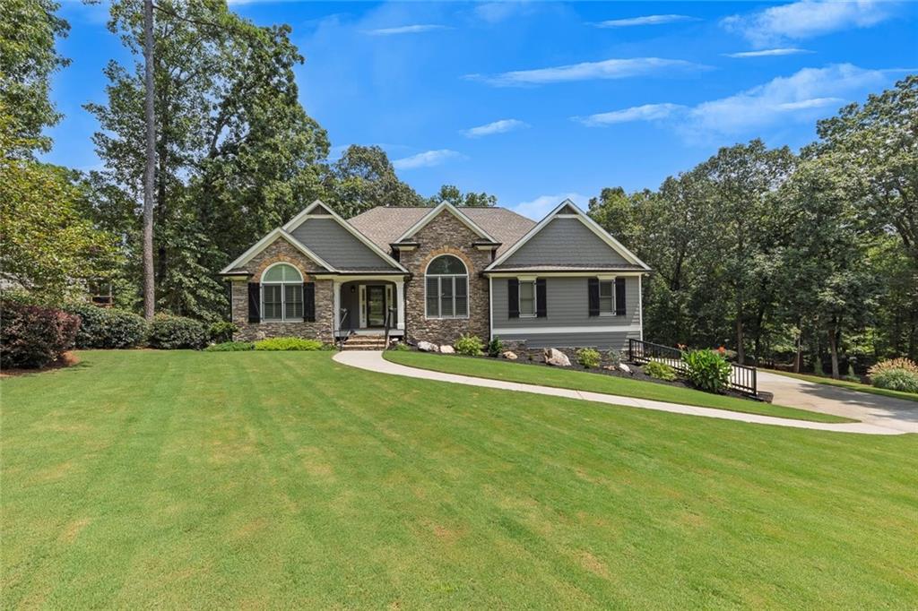 Meticulously maintained Ranch home on finished basement, situated on a large 1.24 acre fenced homesite. Gleaming hardwood flooring greets you in the entry foyer and flows through the main level. New Quartz counters and tile backsplash in kitchen. Spacious master suite with new enlarged shower in bath and custom closet system. Quartz counters in master bath and 2nd bath on main level. Finished terrace level is perfect for multigenerational use, in-law or teen suite. Screened porch with newer flooring, irrigation system and 3 car garage with workshop area are just some of the outstanding features of this home.