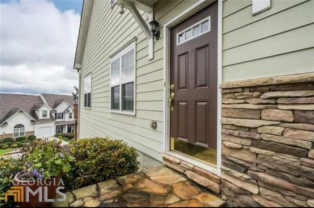 Great location! Mountaintop community. Convenient to I-75 and 575, KSU, shopping and dining. Ten minutes to KSU. Corner lot is the best location in the development. From back deck you have an unrestricted view of Kennesaw Mountain. Owner's suite on main level. Each of the three levels provides ample living space with bedrooms with walk-in closets, full bathrooms, and individual living rooms. Large loft upstairs perfect for teen retreat or additional family room area. Main level has REAL hardwood floors throughout. Beautifull custom tiled bathroom with custom built frameless shower door, wall tiled from floor to ceiling behind vanity. terrace level has new LVP flooring throughout and a large laundry/storage room and updated bathroom and patio. Third level with bedroom, two walk-in closets, and coat closet, large bathroom and loft living area. Community has an Olympic size pool, tennis courts, playground and clubhouse. Kitchen has newer appliances and hood vented to outside. This one won't last long!