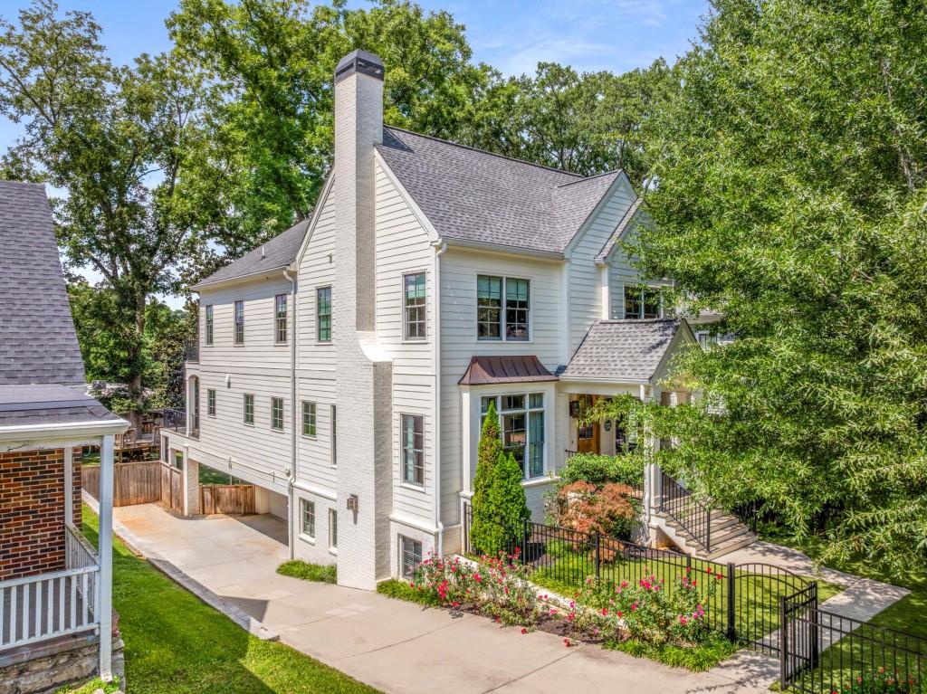 In the heart of Atlanta's beloved Candler Park, this custom-built residence by Mercer Harris Homes redefines modern Southern living. Blending timeless craftsmanship with contemporary design, the home offers five bedrooms and four-and-a-half baths, each finished with the finest details and custom cabinetry that speak to its bespoke character. An open-concept floor plan creates an inviting sense of flow, anchored by a chef's kitchen complete with a walk-in pantry and a scullery-style wet bar- perfectly suited for both lively gatherings and quiet evenings at home. Beyond the kitchen, a screened-in porch with a built-in heater extends the living space outdoors, offering a year-round retreat for morning coffee or evening cocktails. Every detail of the exterior has been thoughtfully designed for both beauty and play. The turf-lined front and backyard frame an enchanting custom-built tree house and a putting green, creating a rare urban sanctuary for relaxation and recreation alike. The home's interior comforts are equally impressive: a finished basement offers flexible space for entertainment or work, while the two-car garage with EV charging outlet and whole-house water filtration system provide modern-day convenience and peace of mind. Set within strolling distance of the Candler Park playground, the historic golf course, eclectic shops, celebrated restaurants, and neighborhood schools, this home offers more than a residence-it offers a lifestyle defined by ease, elegance, and connection.