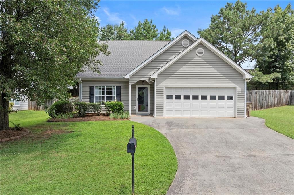 Welcome! This charming home offers the perfect blend of style, comfort, and low-maintenance living in a fantastic Holly Springs location. The spacious, open-concept layout features the primary suite on the main level, providing ease and convenience for everyday living. You'll love the vaulted fireside family room, filled with natural light and open to the dining area and kitchen—complete with gas range, breakfast bar, and direct access to your private back patio, perfect for morning coffee or casual entertaining. Upstairs, you'll find two generous secondary bedrooms, a full bath, and a versatile loft—ideal for a home office, playroom, or cozy retreat. The home also includes a 2-car garage- No HOA! Whether downsizing, right-sizing, or just starting out—this home is a must-see!