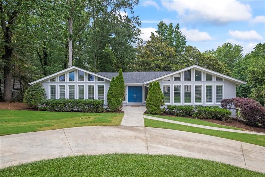 This beautifully updated home in the sought-after Wheeler High School district offers 4 bedrooms and 2.5 bathrooms on the main level, plus a fully finished basement with an additional living room, storage room, rec room, and workshop plus a bedroom and full bath—ideal for in-laws, guests, or a private office space. Situated on a landscaped corner lot in a well-maintained swim community with pool, clubhouse, sidewalks and a swim team, this home has been thoughtfully renovated throughout. The bright white kitchen features quartz countertops, stainless steel appliances, a navy tile backsplash, and opens to a sunny breakfast area. The large pantry, half bath, and laundry are all convenient to the kitchen, perfect for those who entertain. Plantation shutters throughout add a high end touch along with the solid wood doors in every room and closet. Two fireplaces provide cozy gathering spots—one in the vaulted living room with exposed beams and another in the basement level. The primary suite includes a spacious walk-in shower and double vanity. Enjoy the private backyard with room to relax or entertain on the large deck. Conveniently located near parks, shopping, and major highways, this move-in ready home combines style, space, and location.