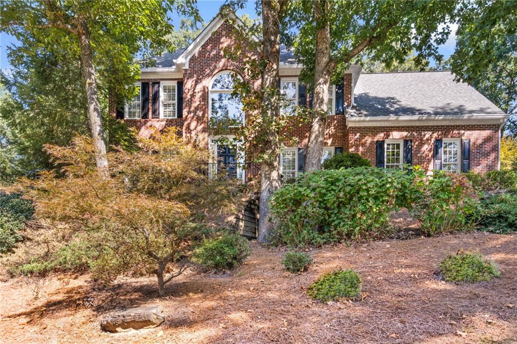 Welcome to your new home in the highly sought-after Foxhall subdivision! This beautifully maintained 3-sided brick home offers a perfect blend of charm, function, and space for everyday living and entertaining.
Step into the two-story foyer with gleaming hardwood floors, flanked by a cozy sitting room on one side and a formal dining room on the other. The bright, open family room features a gas fireplace and flows seamlessly into the airy kitchen —perfect for gatherings. You'll love cooking in this open kitchen with stainless steel appliances, large island, and granite counters.
Upstairs, retreat to the spacious primary suite with double closets and vanities, while three additional bedrooms—each with plantation shutters—share a well-appointed bath.
The finished basement adds incredible versatility: a freshly painted rec room ready for movie nights or playtime, plus a bonus room ideal for an office, home gym, or workshop. And yes—there’s plenty of storage, too!
Step outside and enjoy your private, fenced backyard oasis. A deck off the kitchen overlooks an expansive hardscape and lush, professionally landscaped yard with the perfect balance of sun and shade. Whether hosting friends, gardening, or letting kids and pets run free, this space has it all.
This home is truly move-in ready—and here’s a fun fact: Alton Brown from Good Eats once cooked and filmed in this very kitchen!
Foxhall offers a vibrant, active lifestyle with swim, tennis, pickleball, playground, greenspace, and clubhouse. You’ll also have the option to join Settindown Creek Golf Club at Ansley Golf Club, located right in the neighborhood.
All of this plus top-rated schools (Sweet Apple Elementary & Roswell High) and convenient access to shopping, dining, and entertainment in Roswell, Woodstock, and Alpharetta.