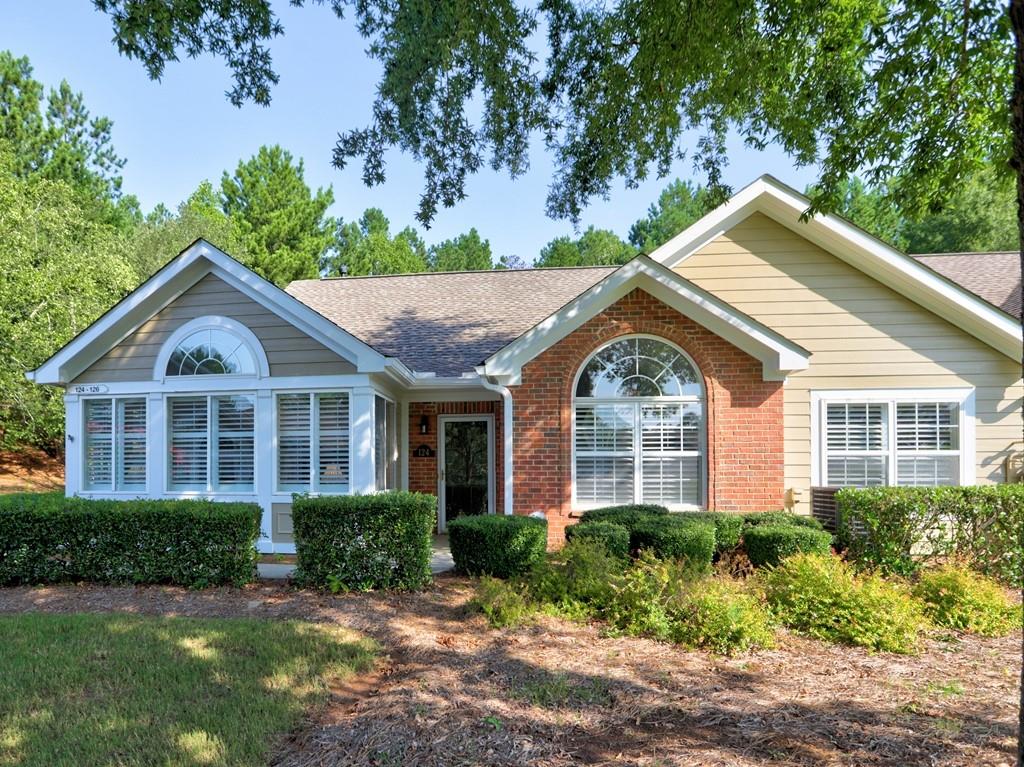 LOCATION - LOCATION - LOCATION! Care free living at its best! Imagine no more yard work or outside maintenance. This condo is situated in a prime location within the community, with a view of the community gazebo, as well as, a view of the wooded property. It is a true 3 bedroom with several updates that I know you will appreciate. The beautiful beveled mirrored wall in the dining room adds such depth and character. The open concept allows for a view from the kitchen to the dining room into the great room. The separate sun room will be your favorite room to relax! Plantation shutters throughout really set off this condo allowing for lots of natural light and/or privacy. As an added feature, the kitchen is equipped with a sky light that brings in even more natural light! The second pantry was updated to a butler's pantry which adds extra counter space to serve off of, along with even more cabinets. The HOA has recently approved for interested homeowners to add a patio near the front door. The clubhouse has a catering kitchen, exercise room, library and shower for after your time in the salt water pool. The Vintage Club has a sidewalk that will take you to Publix, Barnes and Noble and many more shops! Noonday Creek Trail is just around the corner with trails for walking, hiking or biking! You will be near I-75, I-575, Town Center Mall and and an assortment of restaurants!