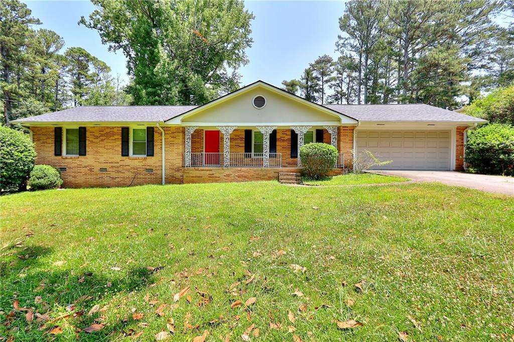 Welcome to this great updated 3 bedroom 2 full bath ranch home situated on more than 1/2 acre lot. Features include a new roof, all windows have plantation shutters, Kitchen is equipped with stainless steel appliances and granite countertops. Large leveled backyard. Replaced septic tank approximately 10 yrs ago. Long driveway street level. 2 car Garage facing the front of the house. This beauty has a Front porch where you can enjoy a nice cup of coffee.